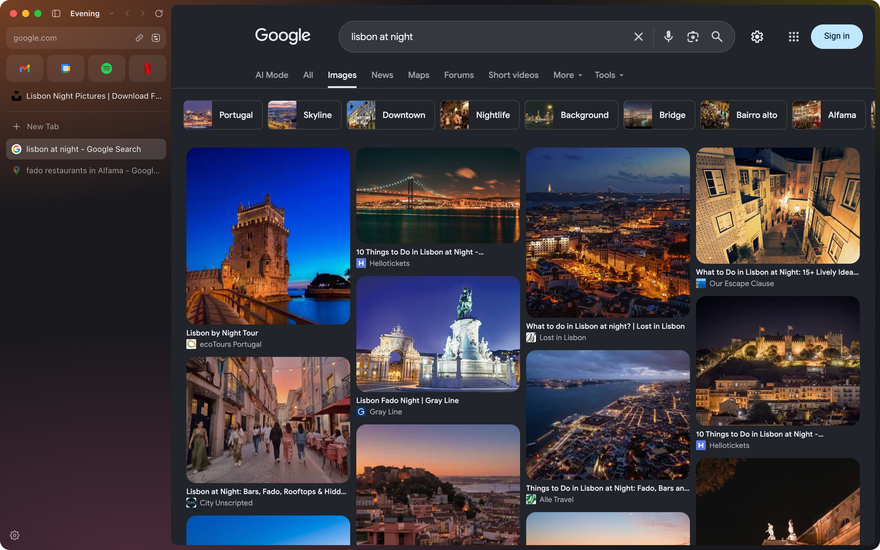 An Evening space in the dark Ember theme, with Google Images showing Lisbon at night, in dark mode.